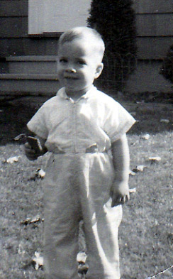 Not Quiet Two Years Old, Using A Graham Cracker Like A Cell Phone To Text In 1958.